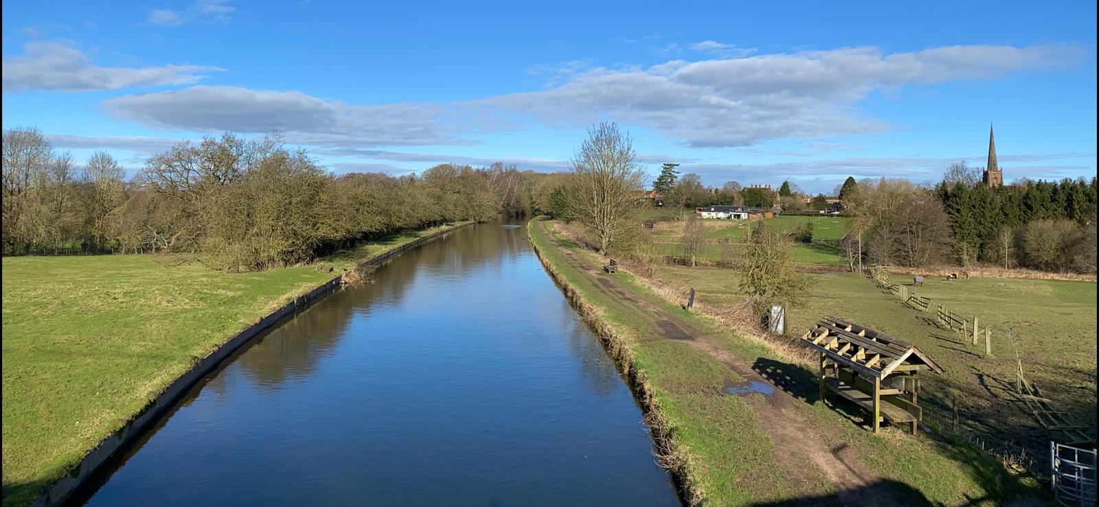 An image of a canal in the countryside